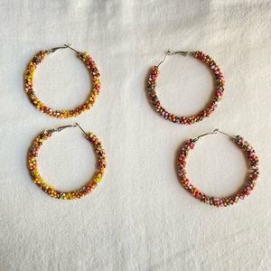 Two pairs of beaded hoop earrings